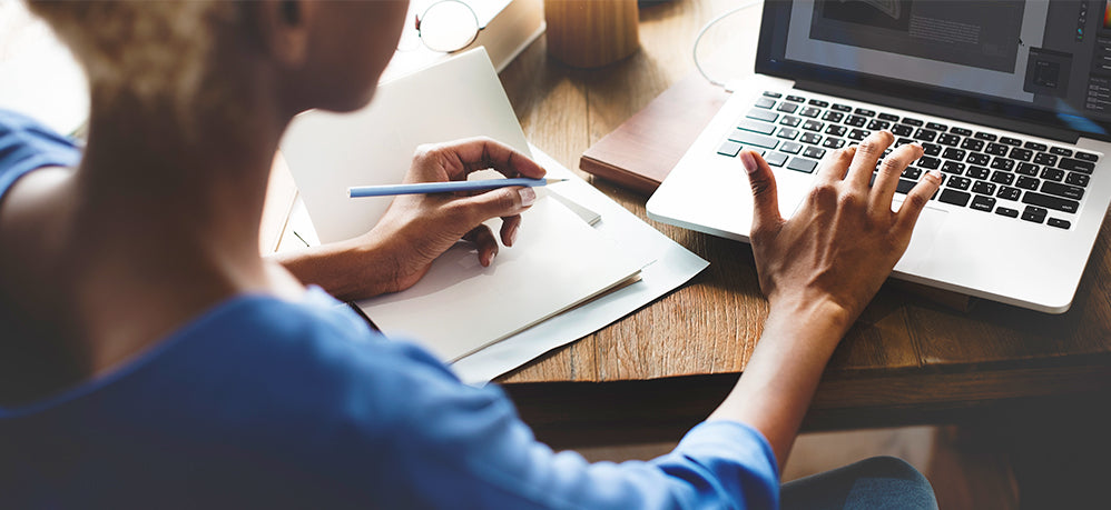 woman working at laptop on desk