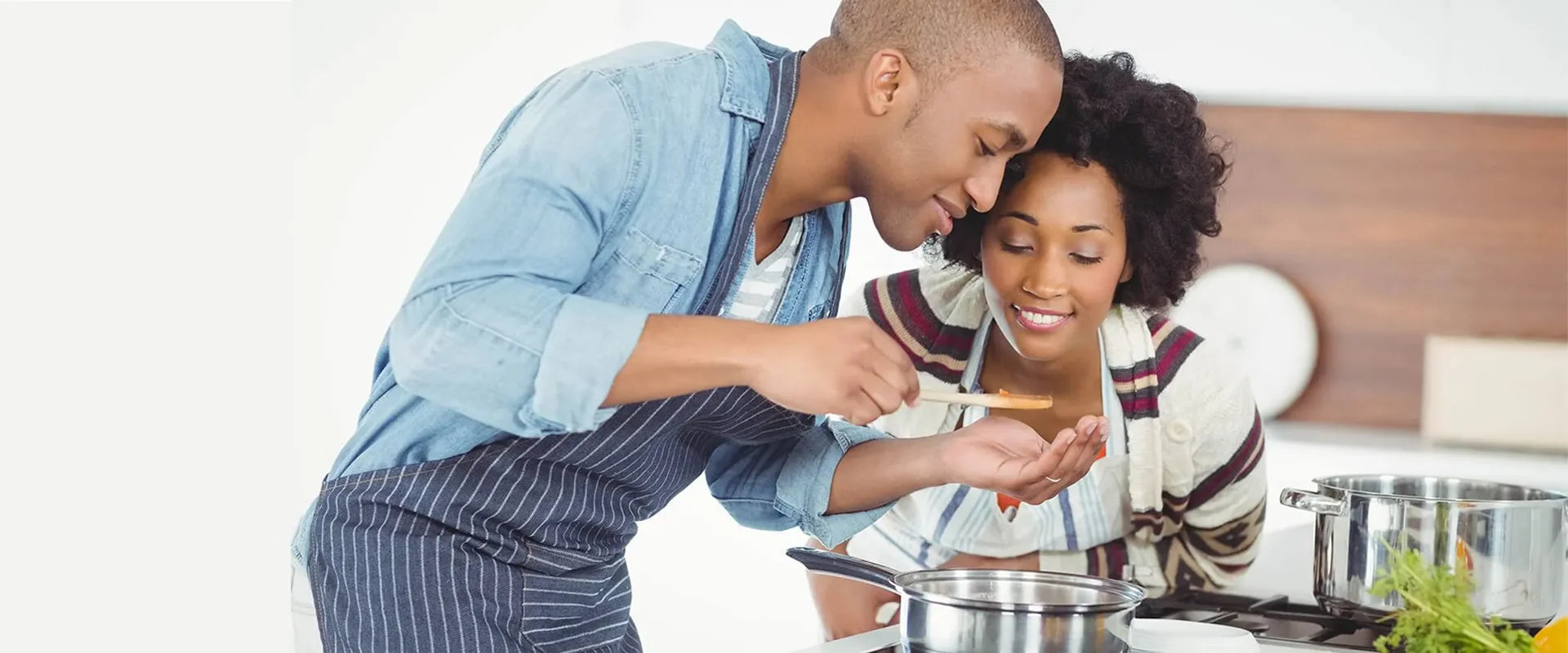 man and woman cooking food